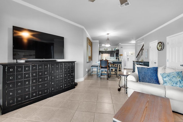 tiled living room featuring crown molding