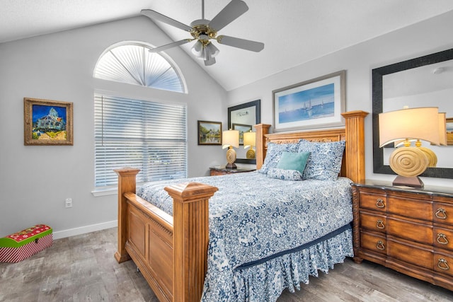 bedroom with multiple windows, light wood-type flooring, and ceiling fan