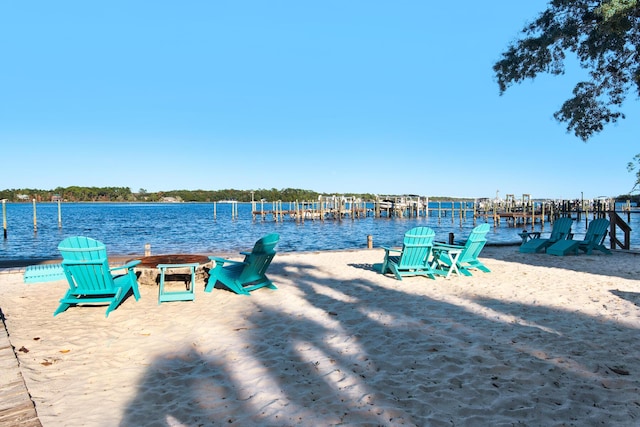 exterior space featuring a water view and a dock