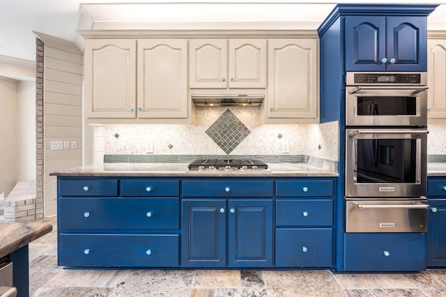 kitchen with range hood, stainless steel appliances, blue cabinets, and a warming drawer