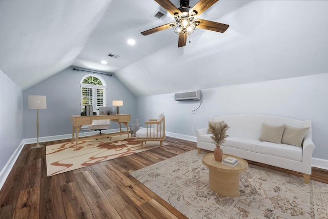 office featuring an AC wall unit, wood finished floors, visible vents, and lofted ceiling