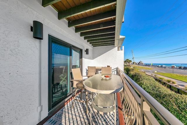 balcony featuring a water view