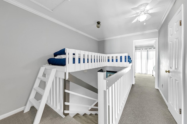 bedroom featuring crown molding, carpet floors, and ceiling fan