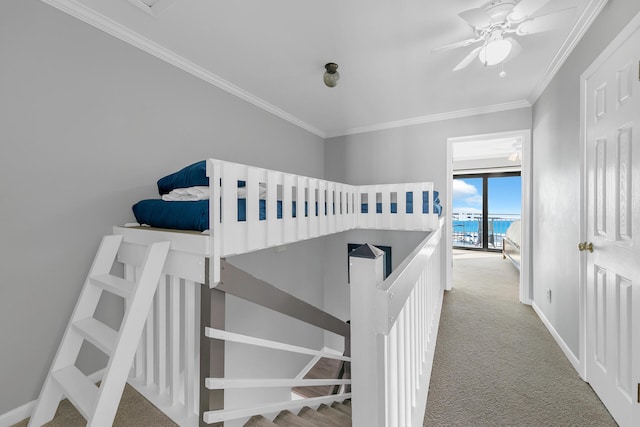 carpeted bedroom featuring ceiling fan and ornamental molding