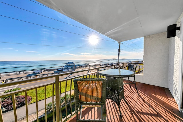 balcony featuring a water view