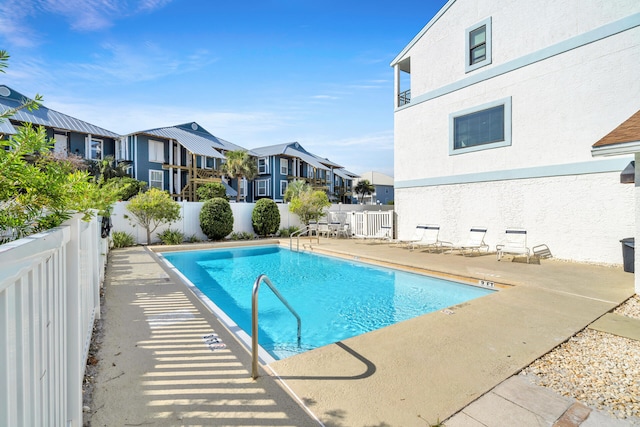 view of swimming pool with a patio area