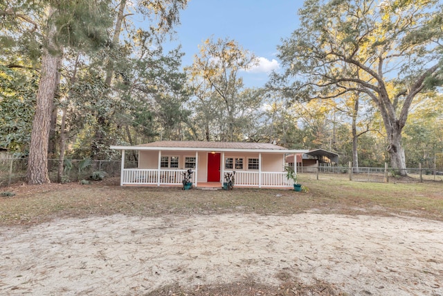 view of front of house featuring covered porch and a carport