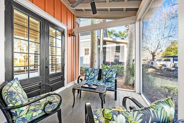 sunroom / solarium featuring ceiling fan and lofted ceiling