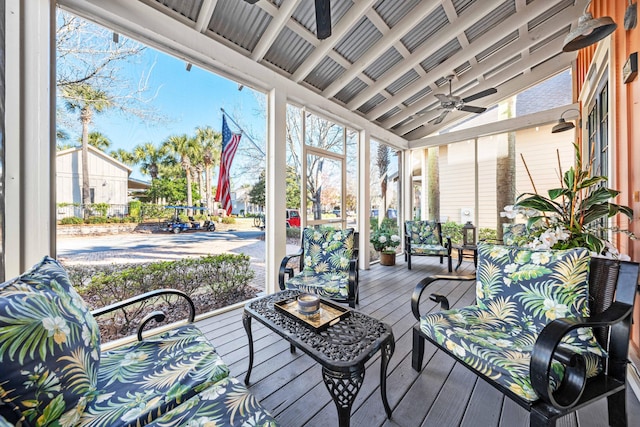 sunroom / solarium featuring ceiling fan and lofted ceiling