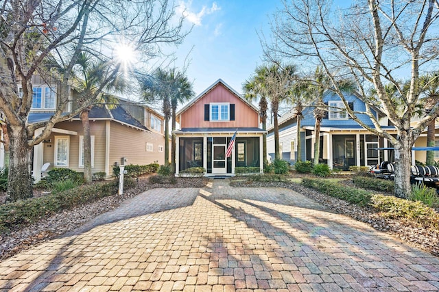 view of front of property with a sunroom