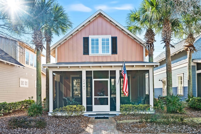 view of front of house with a sunroom