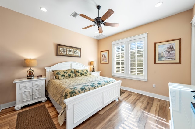 bedroom featuring hardwood / wood-style flooring and ceiling fan