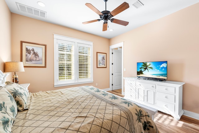 bedroom featuring ceiling fan and light hardwood / wood-style floors