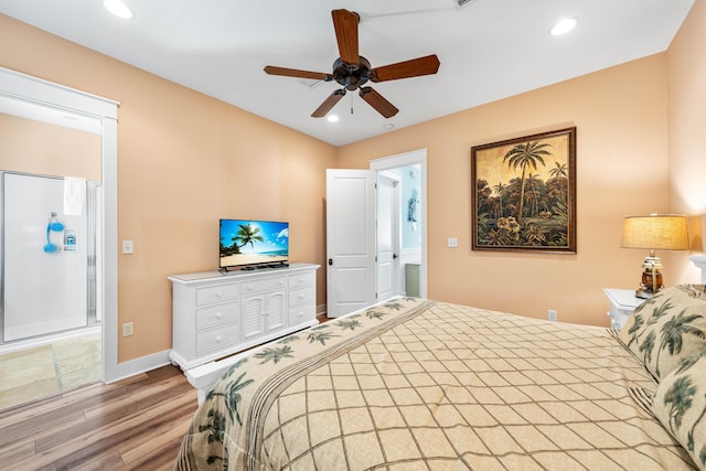 bedroom with ceiling fan, light hardwood / wood-style floors, and ensuite bathroom