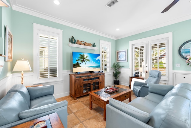 living room with ceiling fan, crown molding, and french doors