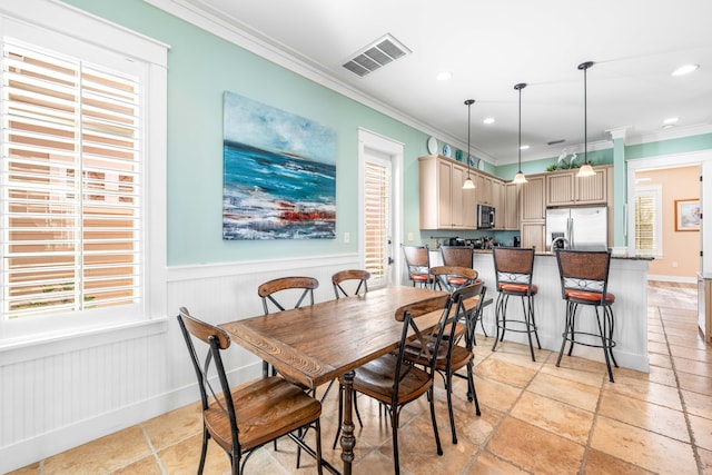 dining room with crown molding