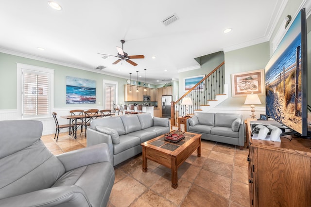 living room featuring ceiling fan and ornamental molding