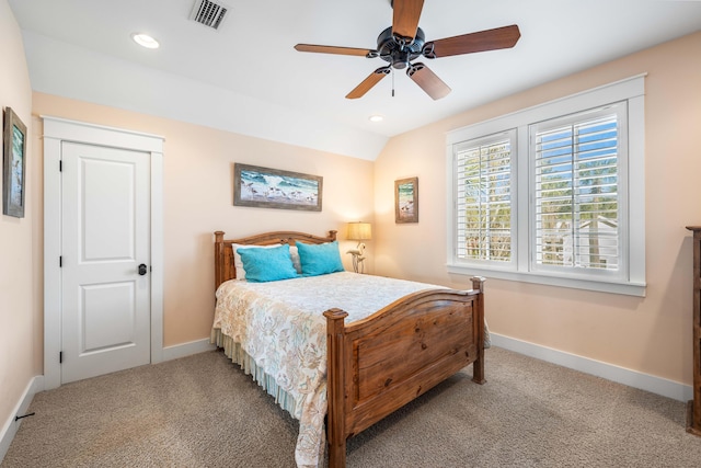 carpeted bedroom with ceiling fan and lofted ceiling