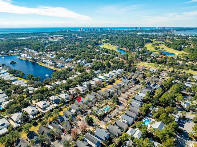 birds eye view of property with a water view