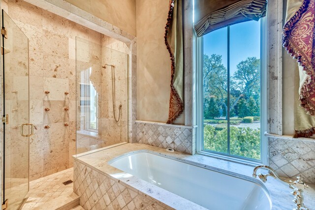 bathroom with separate shower and tub