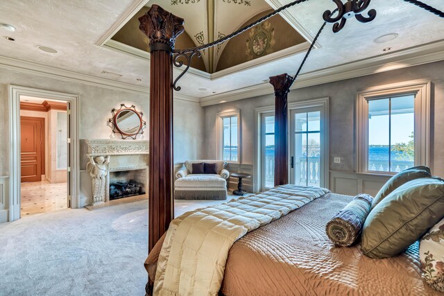 bedroom with carpet flooring, a water view, access to exterior, and crown molding