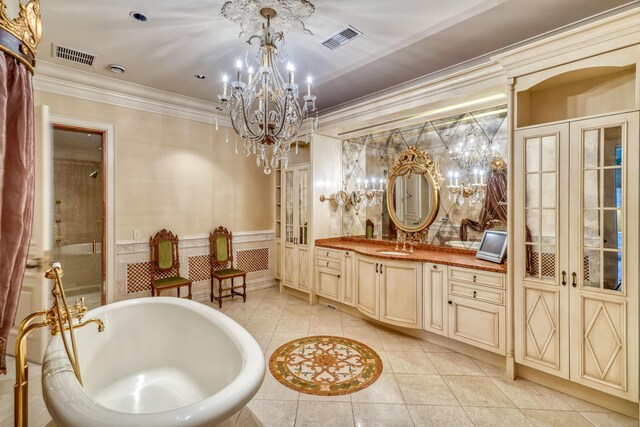 bathroom featuring french doors, vanity, tile patterned floors, and crown molding