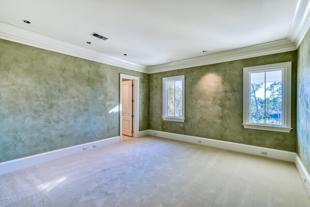 unfurnished room featuring carpet flooring and ornamental molding