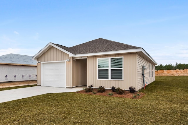 view of front facade with a garage and a front lawn