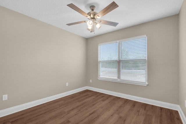 unfurnished room featuring ceiling fan and wood-type flooring