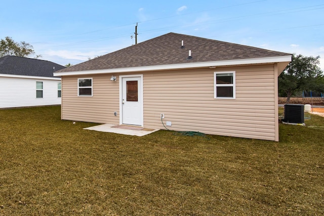 back of property with a yard and cooling unit