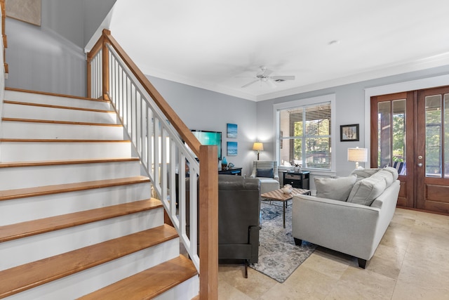 living room featuring a wealth of natural light, french doors, ceiling fan, and ornamental molding