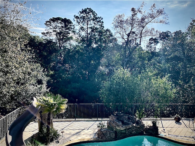 view of swimming pool with a patio area