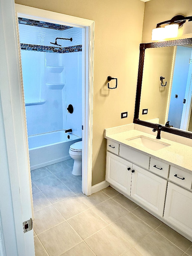 full bathroom with toilet, vanity, tile patterned floors, and shower / tub combination