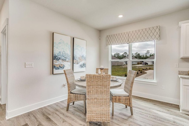 dining space with light wood-type flooring