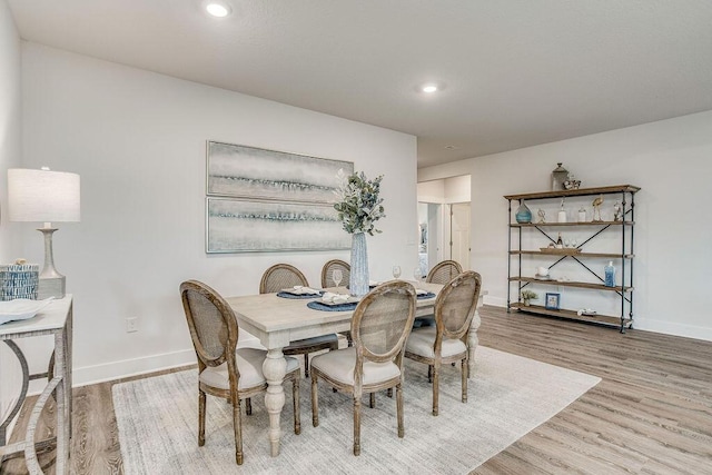 dining area with light hardwood / wood-style flooring