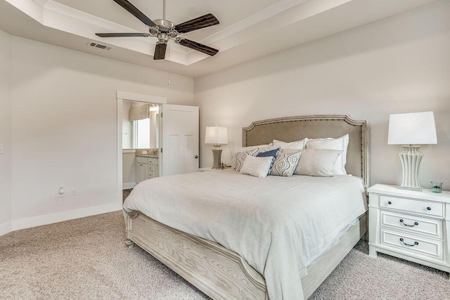 bedroom with connected bathroom, ceiling fan, and light colored carpet