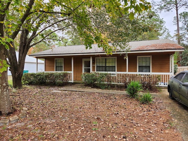 single story home featuring covered porch