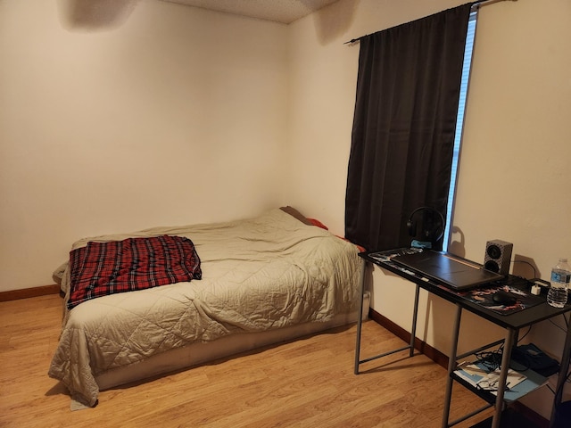 bedroom with light hardwood / wood-style floors