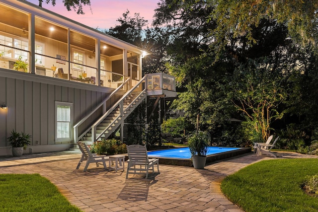 view of patio terrace at dusk