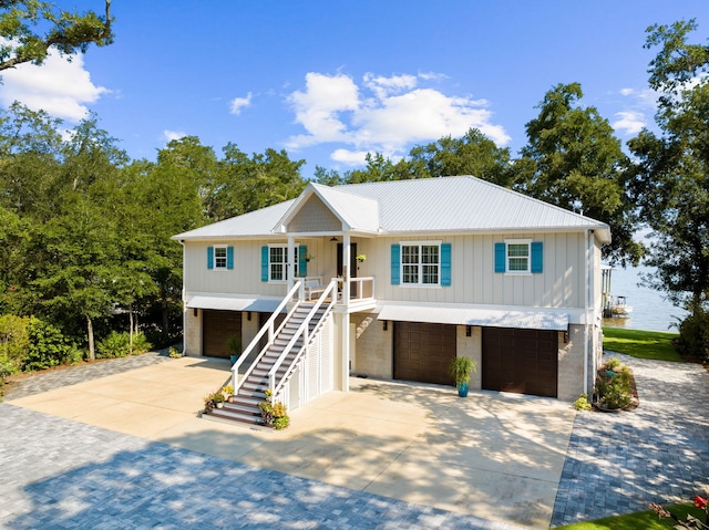 view of front facade with covered porch and a garage