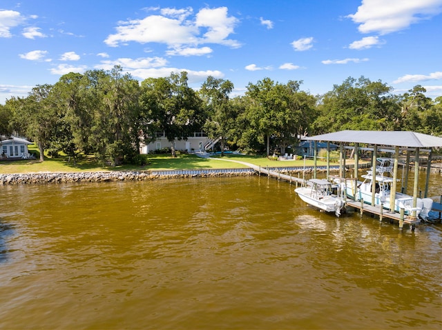 dock area featuring a yard and a water view