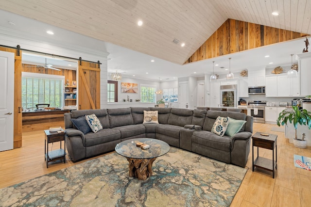 living room featuring a barn door, wood walls, and wood ceiling