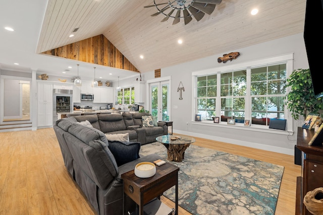 living room with light hardwood / wood-style floors, high vaulted ceiling, ceiling fan, and wooden ceiling