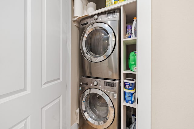 laundry room with stacked washer and dryer