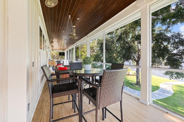 sunroom featuring wooden ceiling