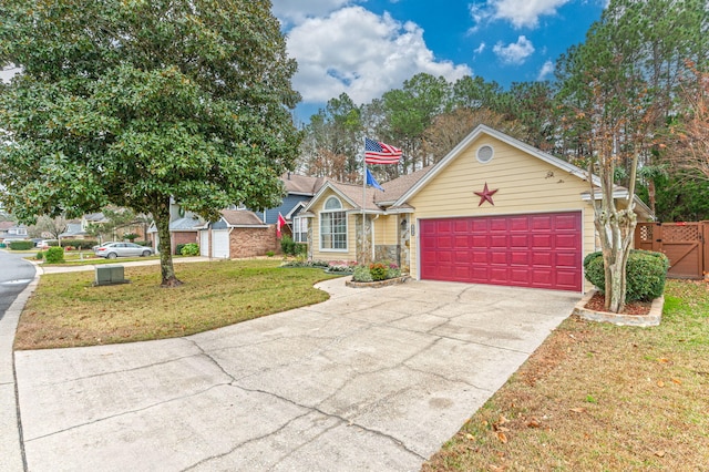 view of front of house featuring a front yard and a garage