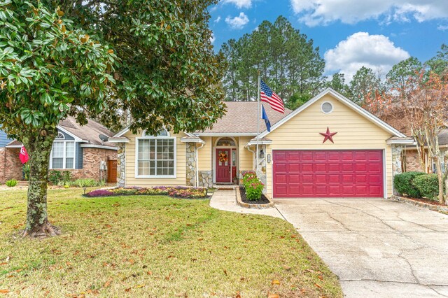 1905 W Mistral Ln, Fort Walton Beach, FL 32547 - view of front facade with an attached garage, driveway, and a front yard