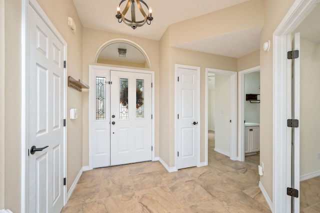 1905 W Mistral Ln, Fort Walton Beach, FL 32547 - entrance foyer featuring a chandelier and baseboards