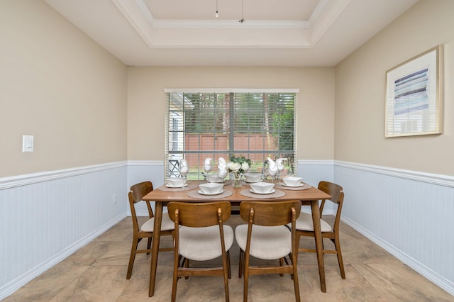 1905 W Mistral Ln, Fort Walton Beach, FL 32547 - dining space with a raised ceiling, a wainscoted wall, and ornamental molding