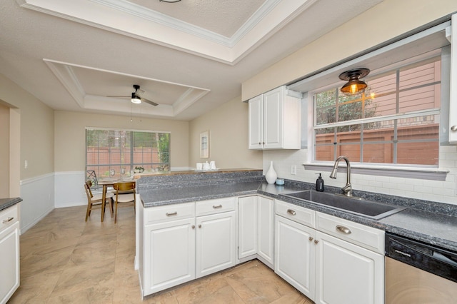 1905 W Mistral Ln, Fort Walton Beach, FL 32547 - kitchen featuring stainless steel dishwasher, a raised ceiling, ceiling fan, a peninsula, and plenty of natural light